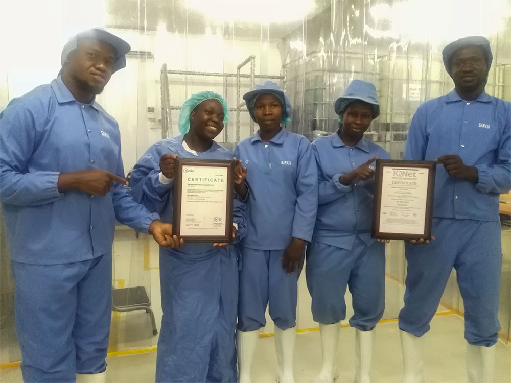 Photo of the Uganda Team with the ISO certifications